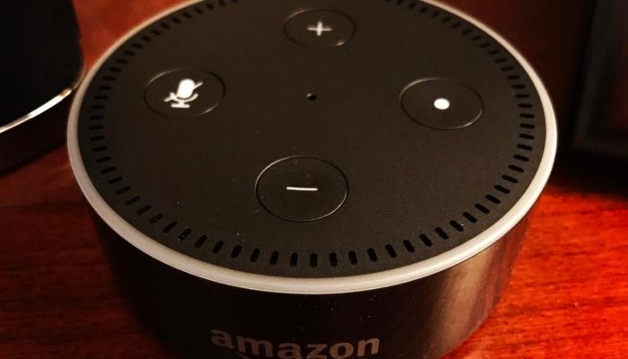 Amazon Echo Dot on wood surface